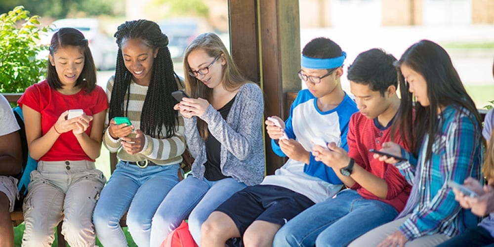 teenagers using phones